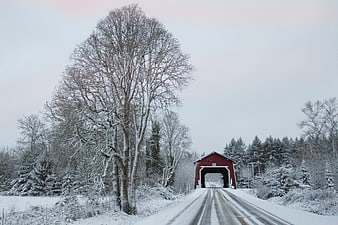 Red Covered Bridge on Snowy Winter Road