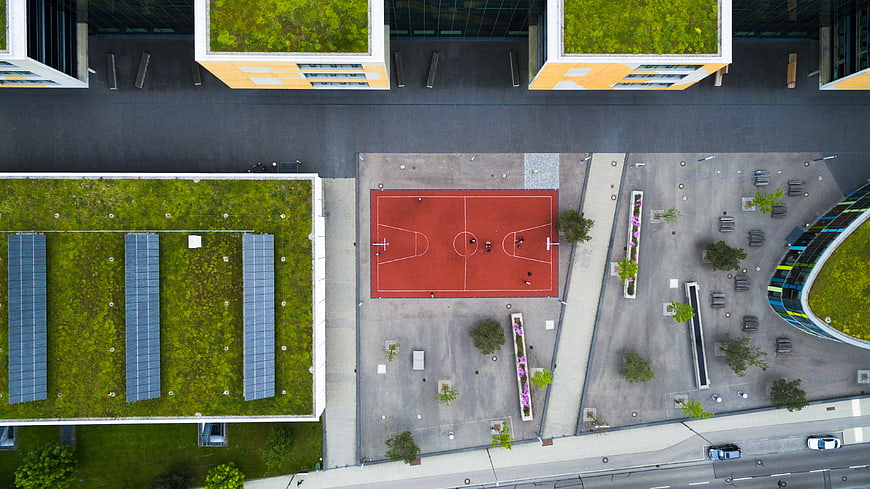 Aerial View of Urban Basketball Court and Green Roofs