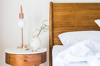 Modern Bedroom Interior with Wooden Nightstand and Lamp