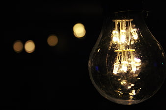 Close-up of vintage LED light bulb with bokeh background