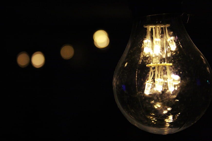 Close-up of vintage LED light bulb with bokeh background