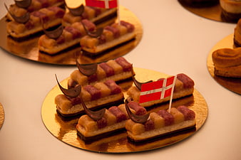 Elegant Danish Pastries With Flags On Gold Platter