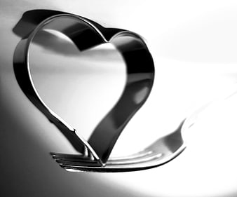Black and white heart-shaped cookie cutter on white background