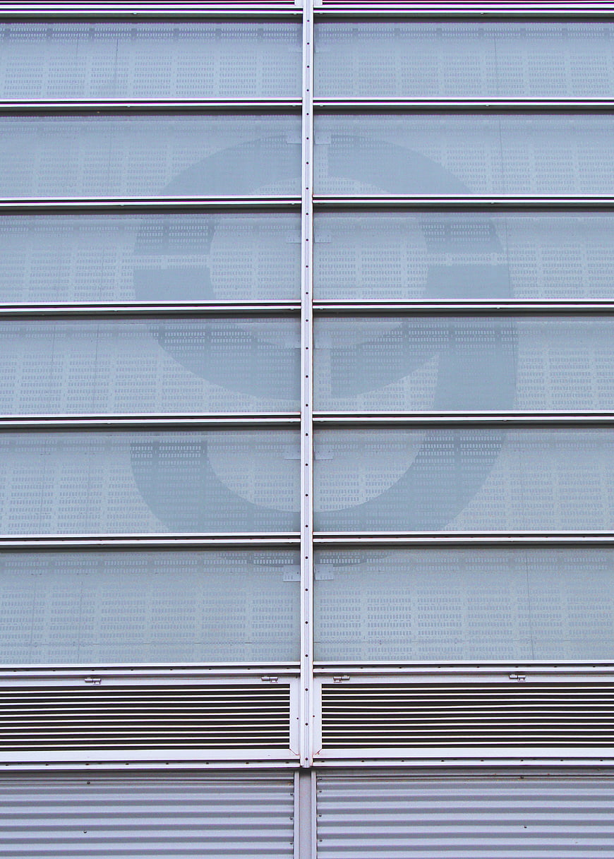Modern building facade with large number nine graphic