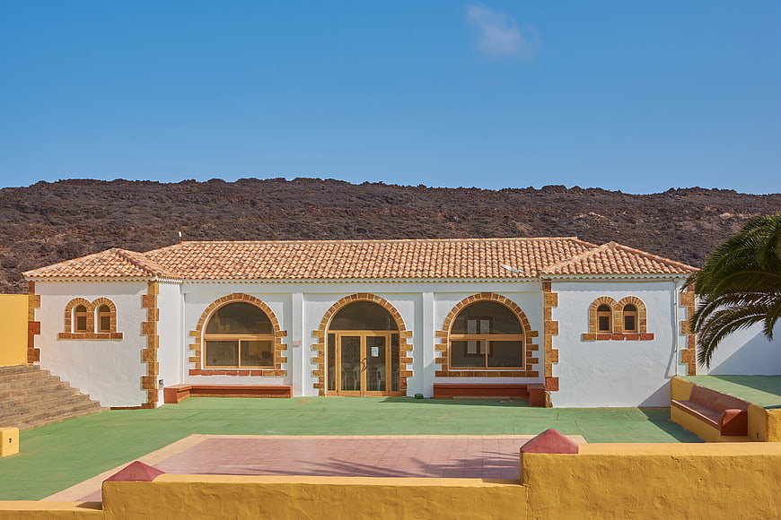 White building with terracotta roof and arched windows in Fuerteventura