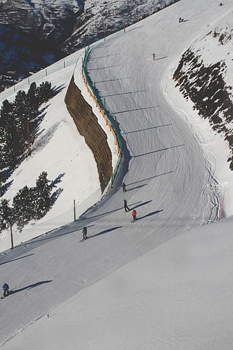High Angle View of Skiers on Snowy Mountain Slope