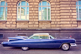 Vintage Blue Cadillac Coupe de Ville Parked on Street