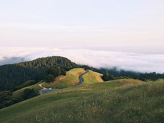 Winding Mountain Road Above Sea of Clouds