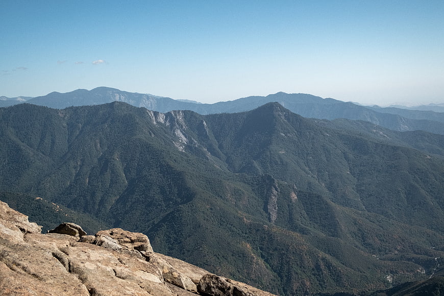 Scenic Mountain Landscape with Rocky Foreground and Blue Sky