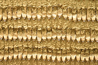 Abstract Pattern of Gold Paint Tubes and Squeezed Texture