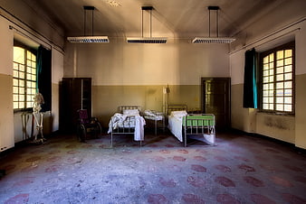 Abandoned Hospital Room with Skeleton and Vintage Medical Beds