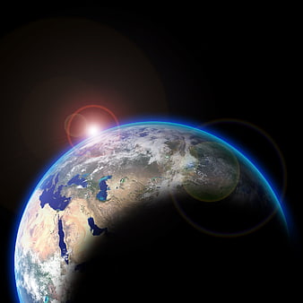Earth From Space With Sun Flare And Blue Atmosphere
