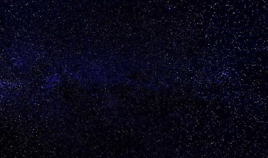 Deep blue starry night sky with Milky Way galaxy