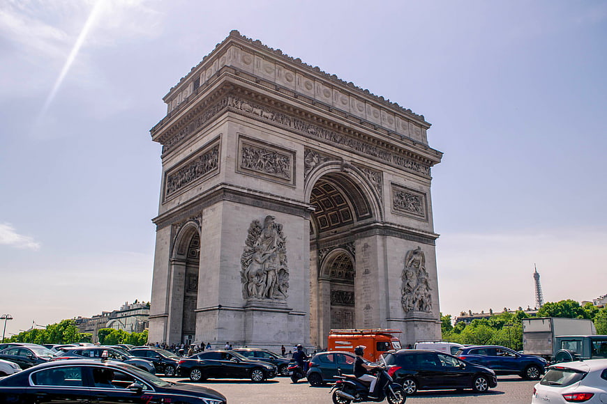 Arc de Triomphe in Paris with Traffic and Eiffel Tower