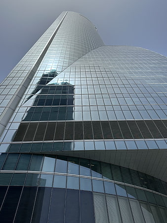 Low angle view of modern glass skyscraper architecture