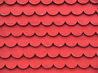 Red scalloped wooden roof shingles texture pattern