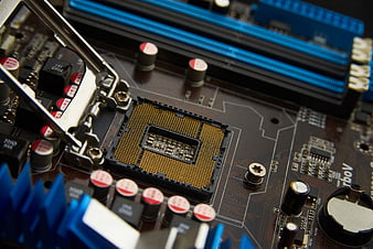 Close-up of computer motherboard CPU socket and RAM slots