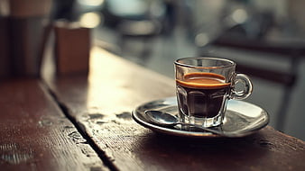 Espresso in Glass Cup on Rustic Wooden Table
