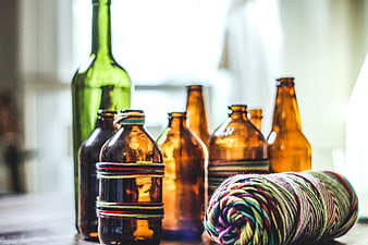 Vintage Glass Bottles and Colorful Yarn Skein