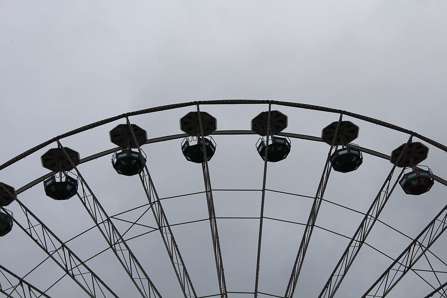 Ferris Wheel Structure Silhouette Against Overcast Gray Sky