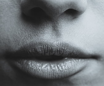 Black and white close-up of a woman's lips and nose