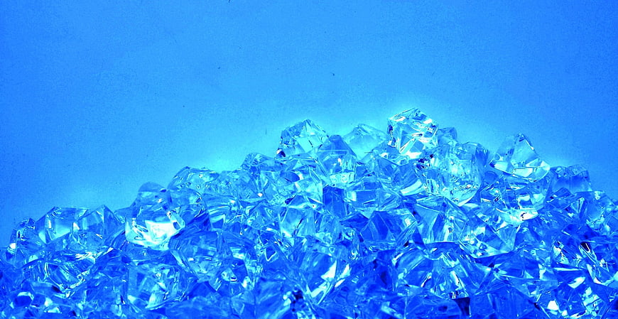 Pile of Blue Crystal Diamonds on Blue Background