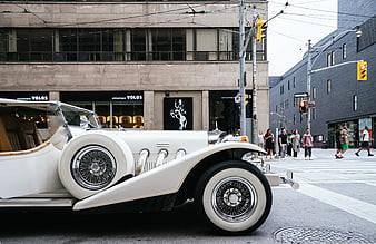 Vintage White Classic Car on Urban Street