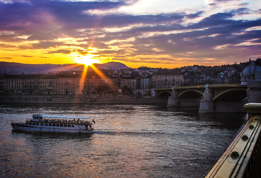 Sunset over Budapest Danube with Chain Bridge and Tourist Boat