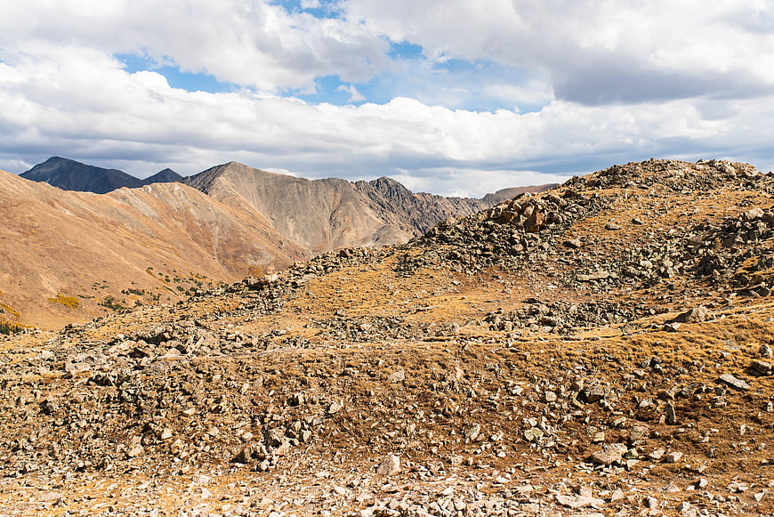 Rugged Rocky Mountain Landscape with Cloudy Sky