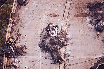 Aerial View of Burnt Out Cars and Debris in Parking Lot