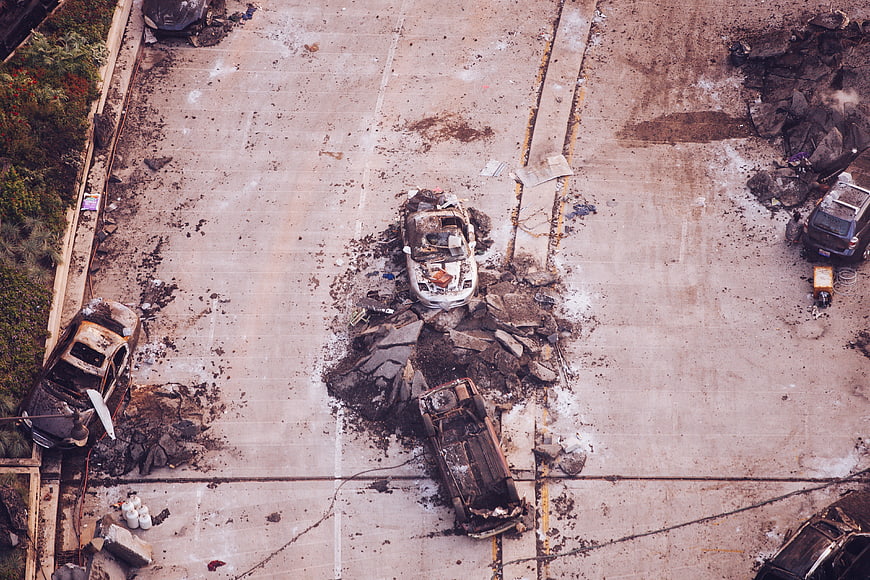 Aerial View of Burnt Out Cars and Debris in Parking Lot
