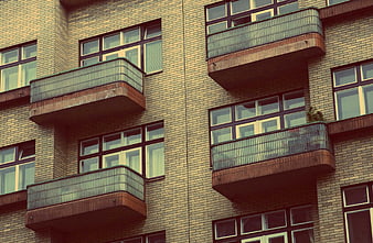 Modern brick apartment building facade with balconies