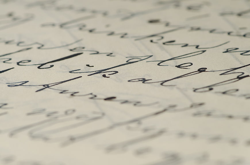 Close-up of elegant handwritten cursive text on paper