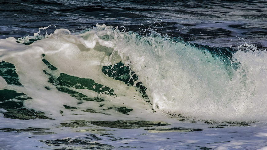 Dynamic Ocean Wave Crashing with White Sea Foam