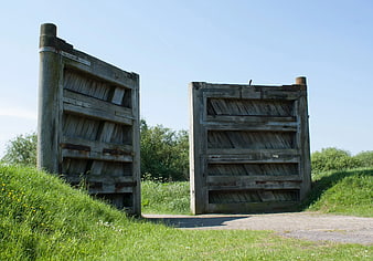 Old Weathered Wooden Gate in Green Field