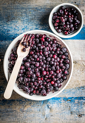 Top View of Frozen Wild Blueberries in Ceramic Bowl