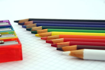 Colorful Pencils and Sharpeners on Graph Paper