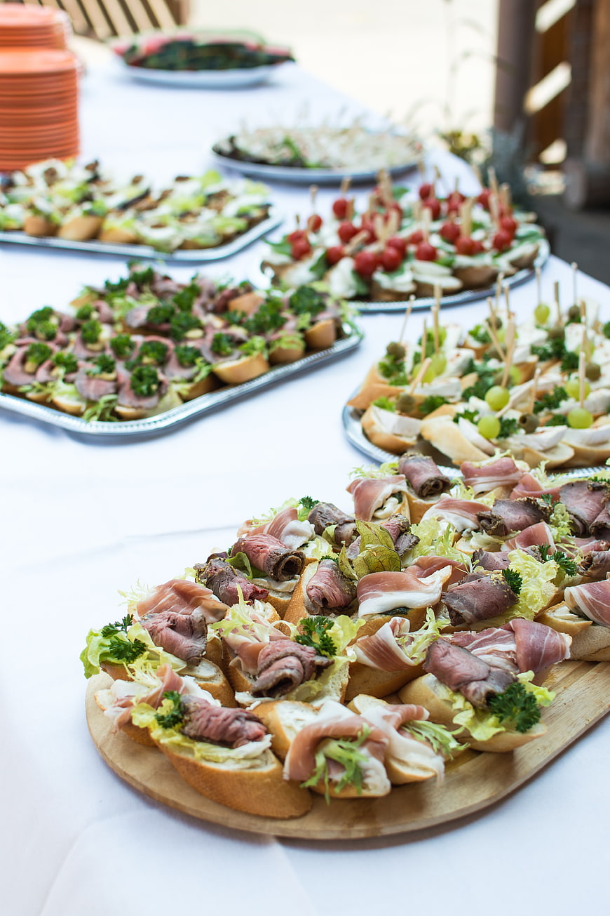 Catering buffet table with assorted canapés and appetizers