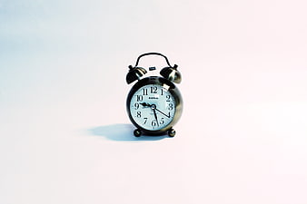 Classic Black Twin Bell Alarm Clock On White Background