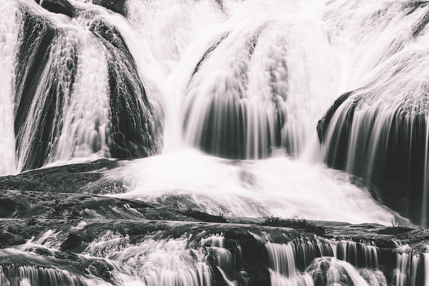 Black and White Long Exposure Waterfall Flowing Over Rocks