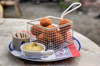 Dutch bitterballen appetizer with mustard dip