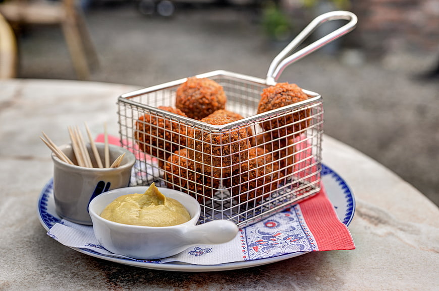 Dutch bitterballen appetizer with mustard dip