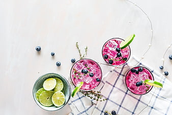 Top View of Pink Blueberry Cocktails with Lime and Thyme