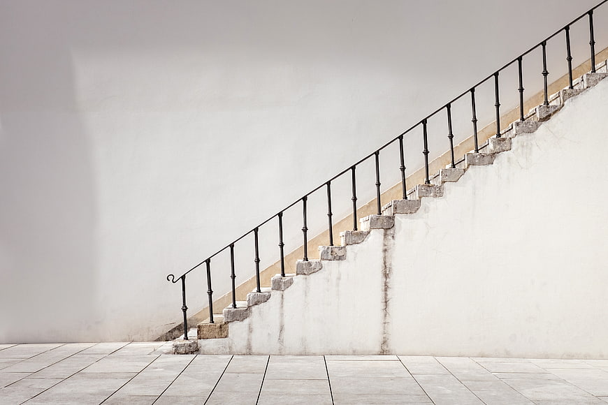 Minimalist White Staircase with Black Iron Railing