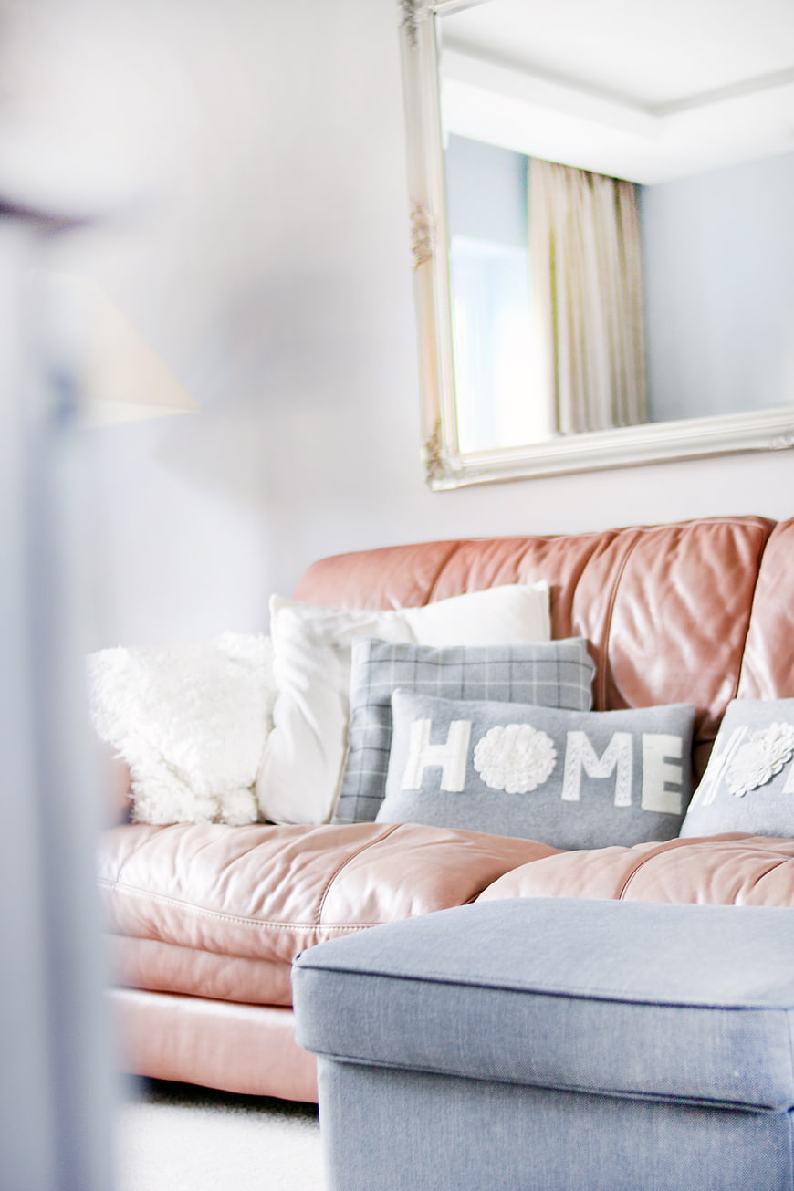 Cozy Living Room with Pink Leather Sofa and Home Pillow