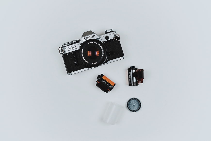 Vintage Canon AE-1 Film Camera Flat Lay with Accessories
