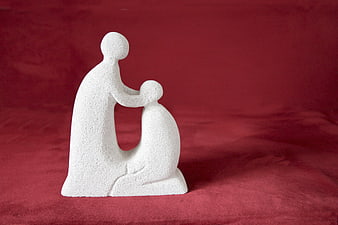 White abstract religious statue of blessing on red background