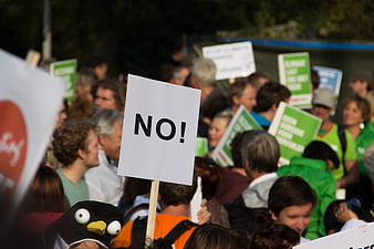 Protest Crowd Holding NO Sign in Public Demonstration