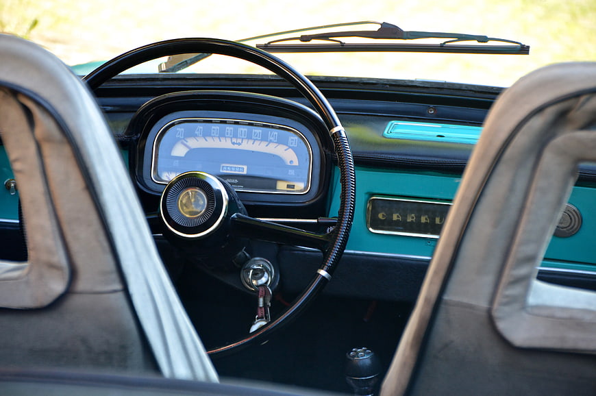 Vintage Car Interior with Retro Steering Wheel and Dashboard