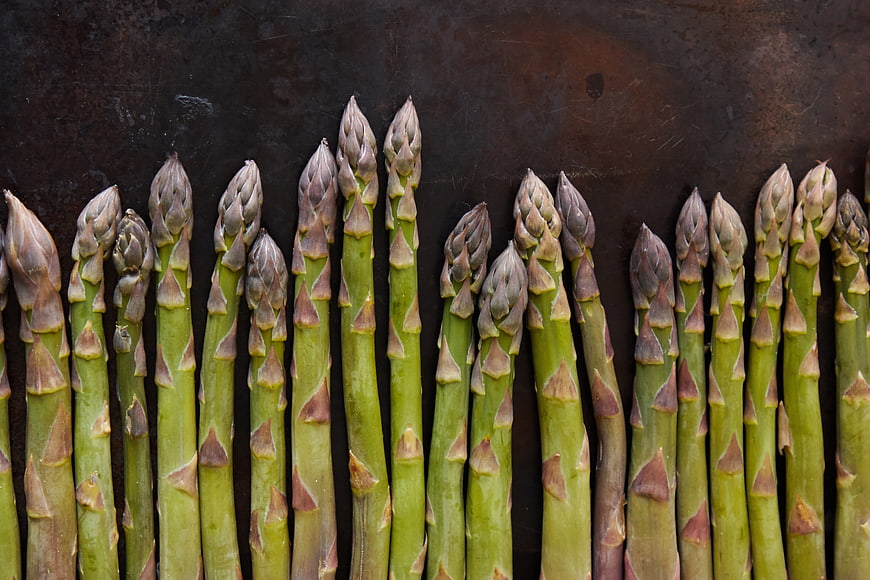 Fresh Green Asparagus Stalks on Dark Rustic Background
